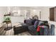 Spacious living room with modern finishes and seamless flow to dining and kitchen at 4882 E Kentucky Ave # A, Denver, CO 80246