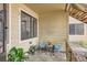 Cozy porch with seating perfect for enjoying the outdoors with plants and lots of light at 4882 E Kentucky Ave # A, Denver, CO 80246