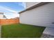 Artificial turf backyard with wooden fence at 6792 Longpark Dr, Parker, CO 80138