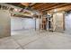 Unfinished basement with concrete floor and exposed utilities at 6792 Longpark Dr, Parker, CO 80138