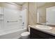 Bathroom with tub, shower, and dark vanity at 6792 Longpark Dr, Parker, CO 80138