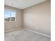 Carpeted bedroom with neutral walls and window at 6792 Longpark Dr, Parker, CO 80138