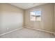 Simple bedroom with neutral walls and carpet at 6792 Longpark Dr, Parker, CO 80138