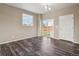 Dining area with wood-look floors and backyard access at 6792 Longpark Dr, Parker, CO 80138