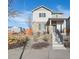 Two-story house with gray siding and stone accents at 6792 Longpark Dr, Parker, CO 80138