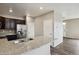 Kitchen with dark cabinets, granite countertops, and stainless steel appliances at 6792 Longpark Dr, Parker, CO 80138