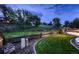 Expansive backyard with lush greenery, mature trees, and privacy at 9412 Burgundy Cir, Highlands Ranch, CO 80126