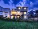 Spacious backyard with a deck, lush greenery, and a beautiful view at 9412 Burgundy Cir, Highlands Ranch, CO 80126