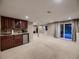 Spacious basement featuring a kitchenette with wine storage and sliding glass doors at 9412 Burgundy Cir, Highlands Ranch, CO 80126