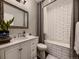 Well-lit bathroom features modern fixtures, a subway-tiled shower, and stylish vanity at 9412 Burgundy Cir, Highlands Ranch, CO 80126