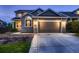 Charming home featuring a brick facade, two-car garage, and well-maintained landscaping at 9412 Burgundy Cir, Highlands Ranch, CO 80126