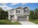 Charming two-story home with gray siding, stone accents, and well-maintained lawn at 9276 Telluride Ct, Commerce City, CO 80022