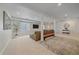 Finished basement with carpet, supports, mounted TV, and a window at 2340 S Columbine St, Denver, CO 80210