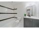 Bathroom with black and white tile, and a vanity with a mirror at 2340 S Columbine St, Denver, CO 80210