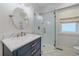 Stylish bathroom with a glass-enclosed shower, marble countertop, and elegant fixtures at 2340 S Columbine St, Denver, CO 80210