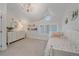 Bright bedroom with a single bed, chandelier, and a window at 2340 S Columbine St, Denver, CO 80210