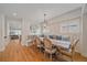 Elegant dining area with custom bench seating, hardwood floors, and stylish lighting at 2340 S Columbine St, Denver, CO 80210