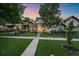 Attractive home exterior with a well-maintained lawn, mature trees, and a welcoming front entrance at 2340 S Columbine St, Denver, CO 80210