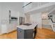 Well-lit kitchen with an island cooktop, stainless steel appliances, and ample cabinet space at 2340 S Columbine St, Denver, CO 80210