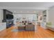 Spacious living room featuring a fireplace, built-in shelving, and hardwood floors at 2340 S Columbine St, Denver, CO 80210