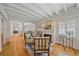 Bright living room with a fireplace, exposed beams, and hardwood floors, creating a cozy atmosphere at 2340 S Columbine St, Denver, CO 80210