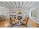 Cozy living room featuring a fireplace, hardwood floors, and comfortable seating arrangement at 2340 S Columbine St, Denver, CO 80210