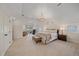 Spacious main bedroom with chandelier, neutral colors, and access to a private balcony at 2340 S Columbine St, Denver, CO 80210