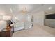 Spacious bedroom with chandelier, neutral carpet, walk in closet, and modern furnishings at 2340 S Columbine St, Denver, CO 80210