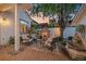 Cozy outdoor living space featuring a stone fireplace, comfortable seating, and a serene fountain for a relaxing atmosphere at 2340 S Columbine St, Denver, CO 80210