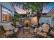 Inviting outdoor patio area with a stone fireplace and comfortable seating, perfect for enjoying evenings outside by the fire at 2340 S Columbine St, Denver, CO 80210