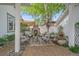 Covered outdoor patio with fireplace, seating area, and water feature at 2340 S Columbine St, Denver, CO 80210
