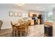 Inviting dining area with wood table adjacent to kitchen at 10700 Kimblewyck Cir # 155, Northglenn, CO 80233