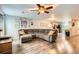 Comfortable living room with modern sectional and ceiling fan at 10700 Kimblewyck Cir # 155, Northglenn, CO 80233