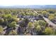 An aerial view shows the neighborhood with mature trees and updated homes at 1248 Meadow St, Longmont, CO 80501