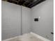 Basement mechanical room featuring block wall and painted concrete floor at 1248 Meadow St, Longmont, CO 80501