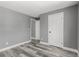 This bedroom has wood floors, white trim, and neutral paint at 1248 Meadow St, Longmont, CO 80501