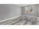 Bedroom with wood floors and a window that looks out to the trees at 1248 Meadow St, Longmont, CO 80501