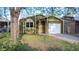 Green single-Gathering home with a white garage door and light trim at 1248 Meadow St, Longmont, CO 80501