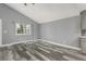 Bright living space with vaulted ceilings, gray walls, modern floors, and lots of light at 1248 Meadow St, Longmont, CO 80501