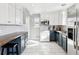 Updated kitchen with white and blue cabinets at 11418 Fowler Dr, Northglenn, CO 80233