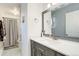 Clean bathroom with a single vanity and shower/tub combo at 8367 S Reed St # A1, Littleton, CO 80128