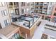 Community amenity deck featuring a pool, fire pit, seating and outdoor grilling area at 20 Wilcox # 421, Castle Rock, CO 80104