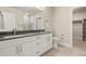 Bathroom with double vanity, modern fixtures, and walk-in closet at 20 Wilcox # 421, Castle Rock, CO 80104