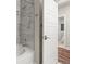 Modern bathroom with gray marble shower and views to ensuite bedroom at 20 Wilcox # 421, Castle Rock, CO 80104