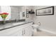 Modern bathroom with quartz counters, white cabinetry, and framed art at 20 Wilcox # 421, Castle Rock, CO 80104
