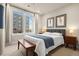 Bright bedroom with large windows, neutral tones, and city views at 20 Wilcox # 421, Castle Rock, CO 80104