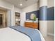 Well-designed bedroom featuring a bathroom view, modern decor, and ample natural light at 20 Wilcox # 421, Castle Rock, CO 80104