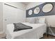 Bright bedroom with a queen bed, decorative mirrors and sliding closet doors at 20 Wilcox # 421, Castle Rock, CO 80104