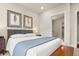 Comfortable bedroom with natural light, feather wall art, and modern décor at 20 Wilcox # 421, Castle Rock, CO 80104