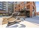 Exterior of building with outdoor restaurant seating and modern metal sculpture at 20 Wilcox # 421, Castle Rock, CO 80104